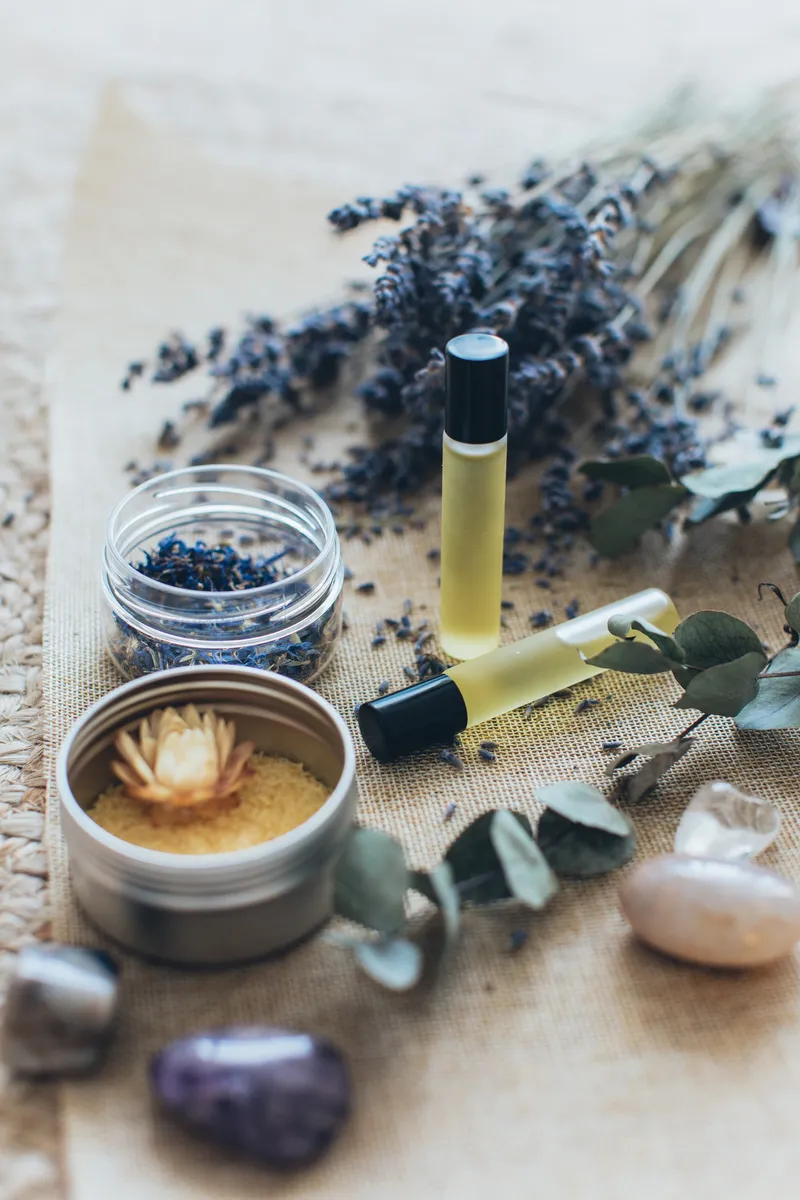 Essential oils, lavender and bath salts on a table